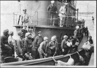 This was made on a tug which took our crew off the sub after mooring in port The officer coming down the ladder is our former Executive Officer. 1945, Portsmouth, N.H.